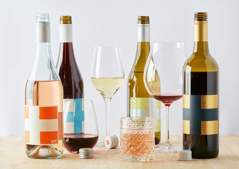 Save our Souls bottles of wine, of different colors, with two cups and a glass.