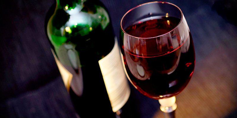 a bottle and a glass of wine