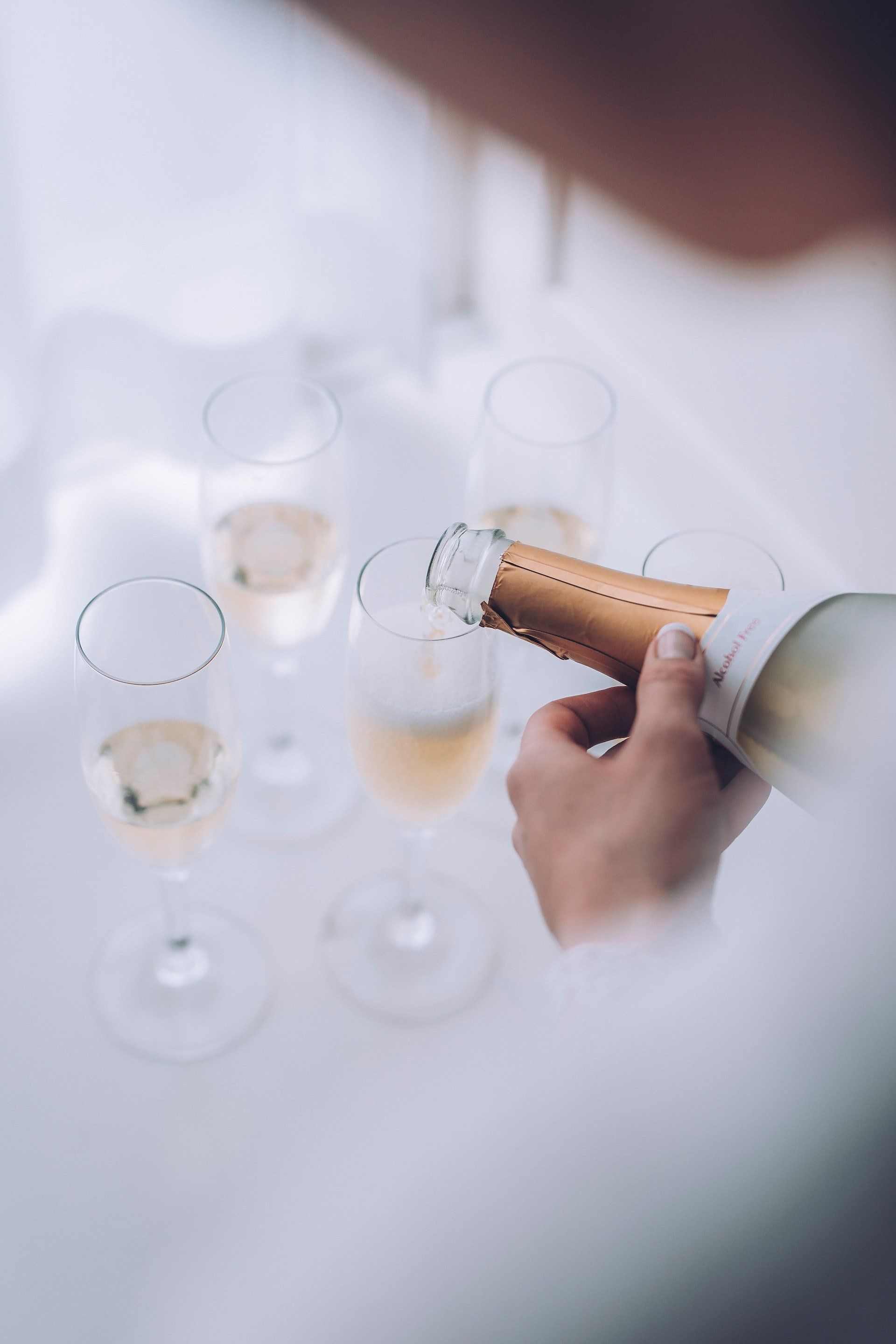 Pouring champagne in flue glasses
