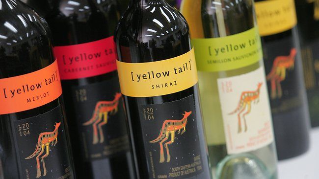 A row of Yellow Tail bottles: Merlot, Cabernet Sauvignon, Shiraz and Semillon Sauvignon Blanc.